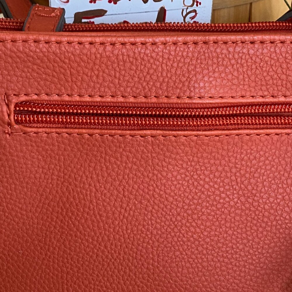 Gently used one time. Rust color both zipper top and snap closed bag w/strap - Picture 2 of 4